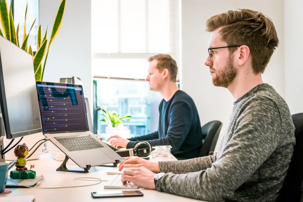Software team working together on business systems