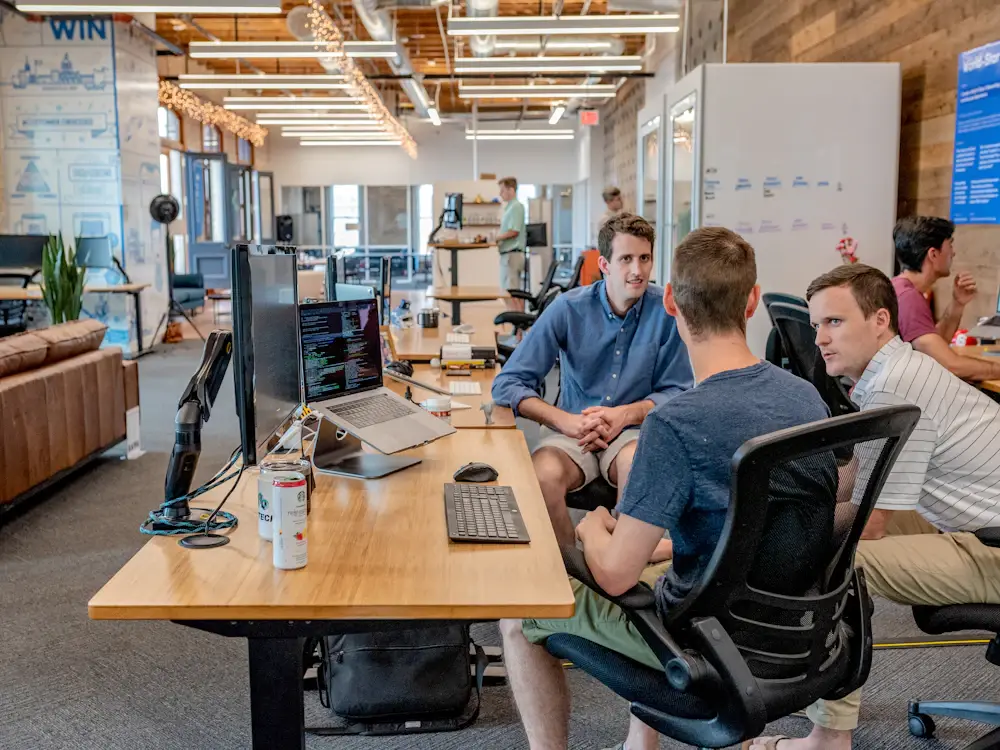 Team discussing a cross-system workflow
