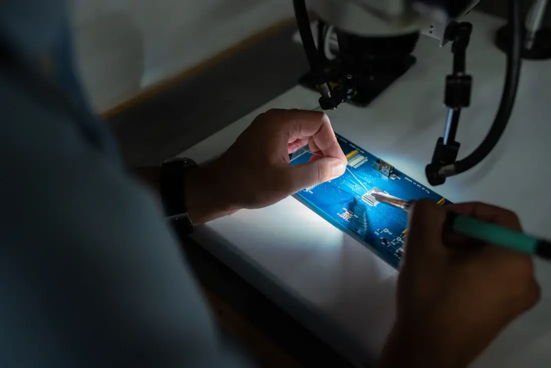 Technician reviewing a quality process in an industrial workspace